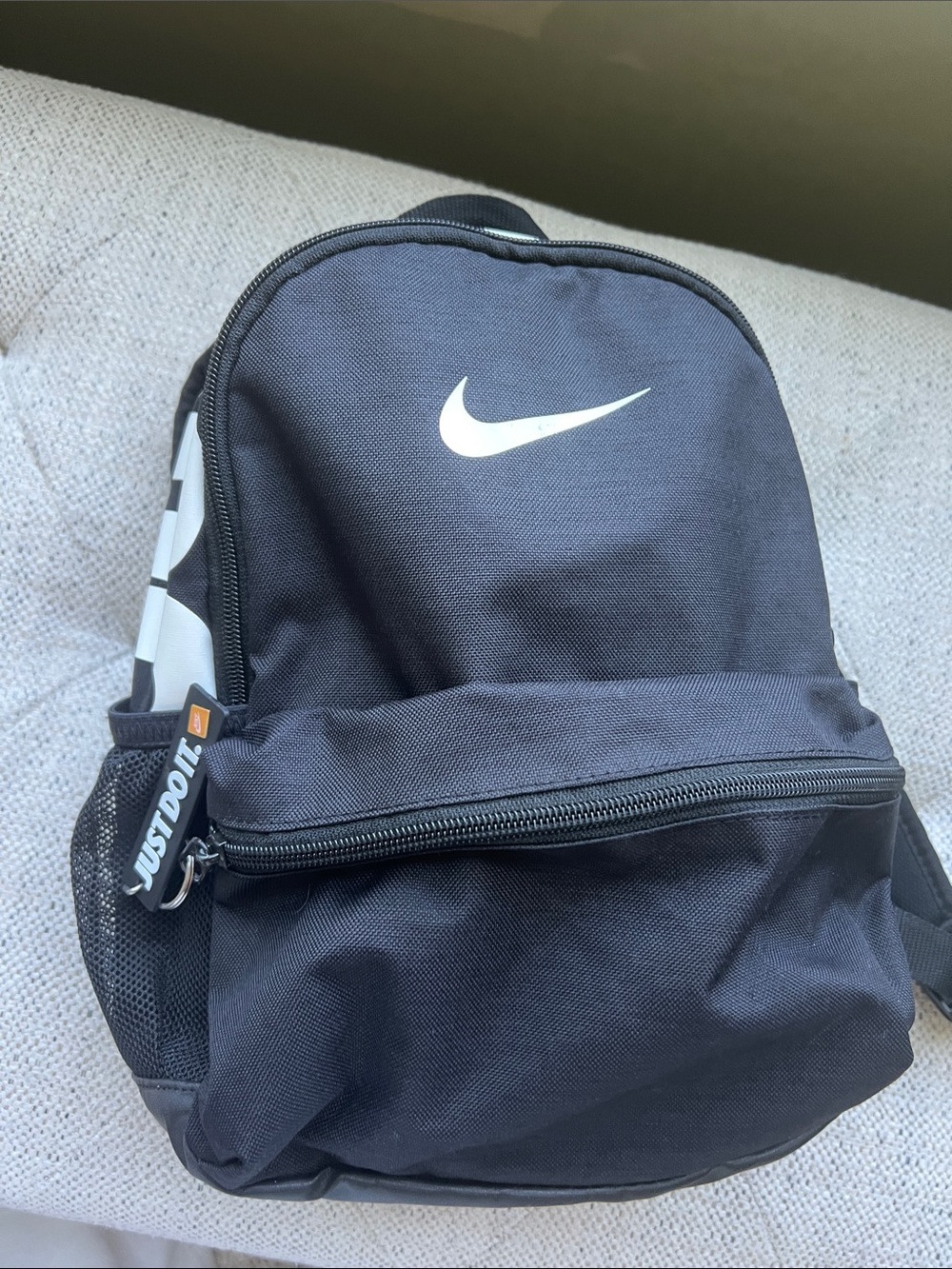 Nike Mini Black Backpack with White Swoosh and Side Accents